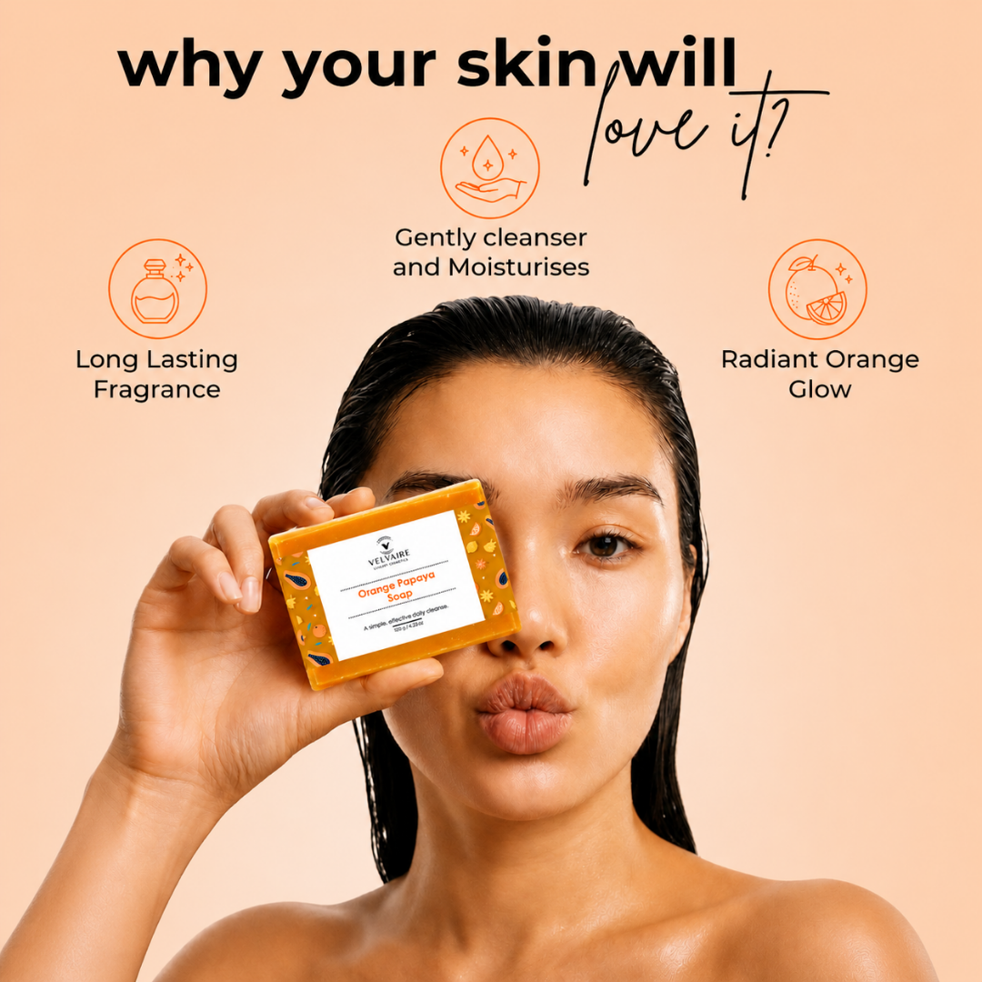 Woman holding Velvaire Orange Papaya Soap highlighting gentle cleansing, moisturizing formula, and long-lasting citrus scent for radiant glow.